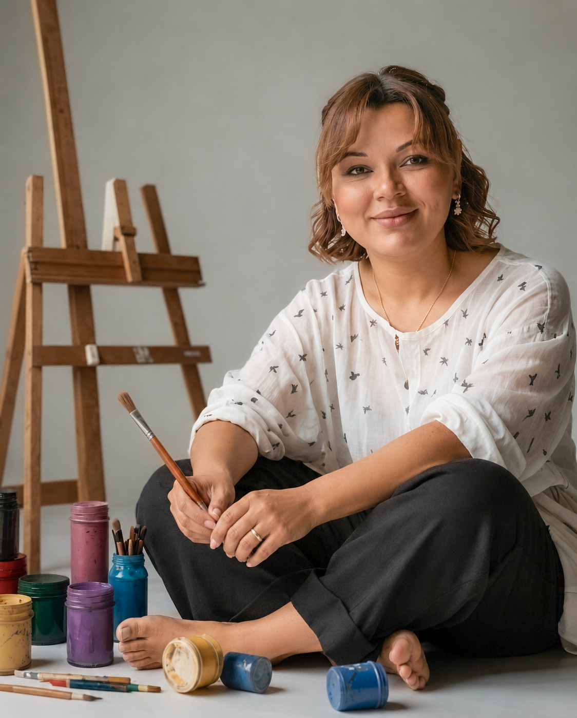 Portrait of Milena Roth, the artist, in her candlelit studio